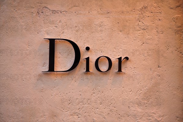 Christian Dior sign signboard on wall of store in Via dei Condotti Rome Italy