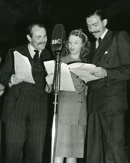 JIMMY EDWARDS UK comedy actor at left with Joy Nichols and Frank Muir recording the BBC's "Navy Mixture" about 1946