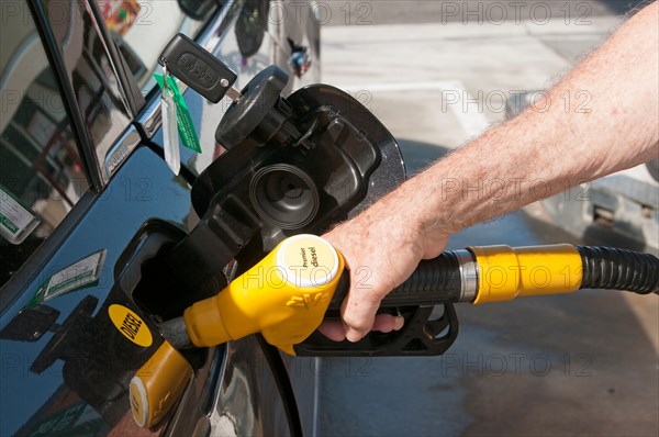 Filling the diesel fuel tank of a Citroen car at a service station
