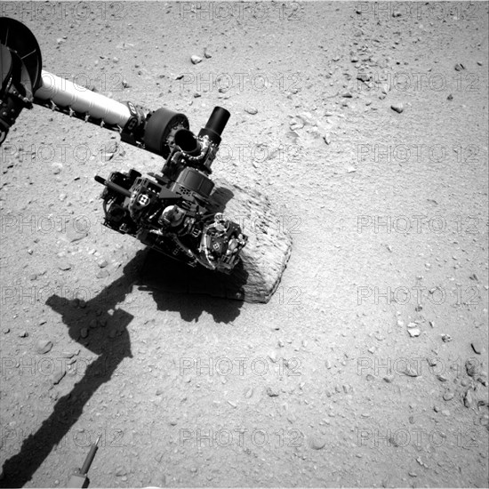 This image shows the robotic arm of NASA's Mars rover Curiosity with the first rock touched by an instrument on the arm. The rover's right Navigation Camera (Navcam) took this image during the 46th Martian day, or sol, of the mission (Sept. 22, 2012). On that sol, the rover placed the Alpha Particle X-Ray Spectrometer (APXS) instrument onto the rock to assess what chemical elements were present in the rock. The rock is named "Jake Matijevic" in commemoration of influential Mars-rover engineer Jacob Matijevic (1947-2012).

JPL manages the Mars Science Laboratory/Curiosity for NASA's Science Mission Directorate in Washington. The rover was designed, developed and assembled at JPL, a division of the California Institute of Technology in Pasadena.