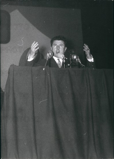 Jan. 01, 1956 - Poujade calls up partisans for mass meeting Pierre Poujade, leader of the new traders and Artisans party, held a mass meeting at the palais Des sports Paris, today. photo shows Poujade addressing his followers.