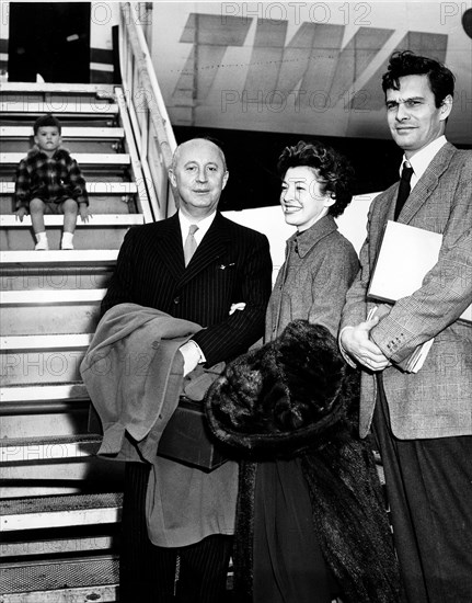 Fashion designer Christian Dior preparing to board a plane