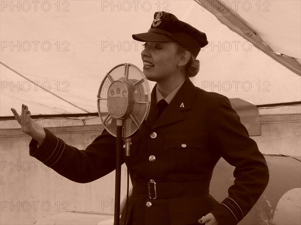 1940s style singer, with BBC microphone