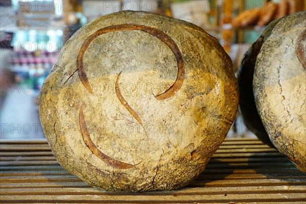 PARIS, FRANCE -22 JUL 2019- Bread loaf from the world famous Poilane bakery, located on rue du Cherche Midi in the 6th arrondissement of Paris.