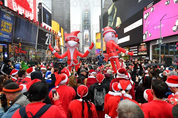 Hundreds of people participate in SantaCon NY, an annual pub crawl in which people dressed in Santa Claus costumes or as other Christmas characters pa