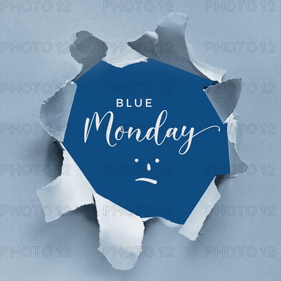 Blue Monday concept background with text and sad smile cartoon in ripped paper hole. Light and classic blue two tone design, torn paper, square compos