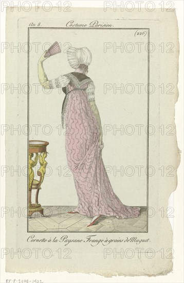 'Cornette à la Paysane'. Fichu trimmed with tassels and beads, "the grains Muguet. Dress with drag and geometric zigzag pattern. Folding fan. The picture is part of the fashion magazine Journal des Dames et des Modes, published by Pierre de la Mésangère, Paris, 1797-1839. Manufacturer : printmaker: anonymous publisher: Pierre de la MésangèrePlaats manufacture: Paris Date: 1800 Physical features: engra, hand colored material: paper Technique: engra (printing process) / hand-color measurements: plate edge: h 184 mm × W 111 mm Subject: fashion plates head-gear (CORNETTE) (+ women's clothes) dress