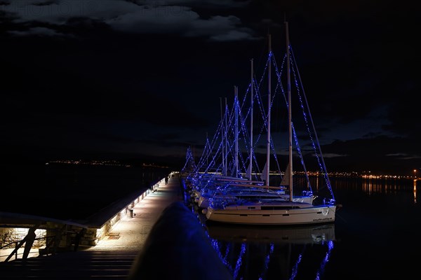 Volos, Greece 12-12-2020, decorated boats for the Christmas and New Year holidays