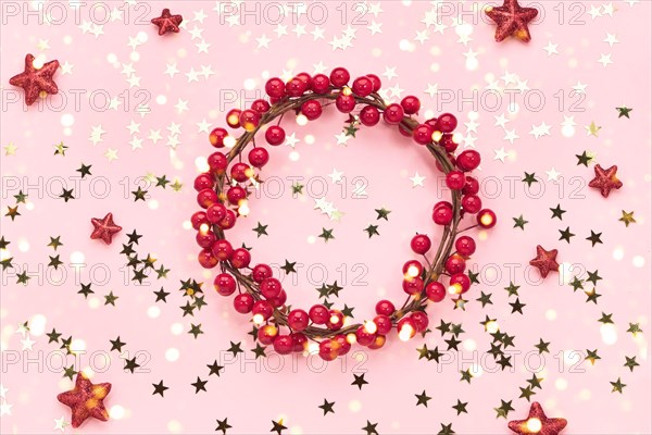 Christmas background. Red Christmas decoration on pink background. Copy space.