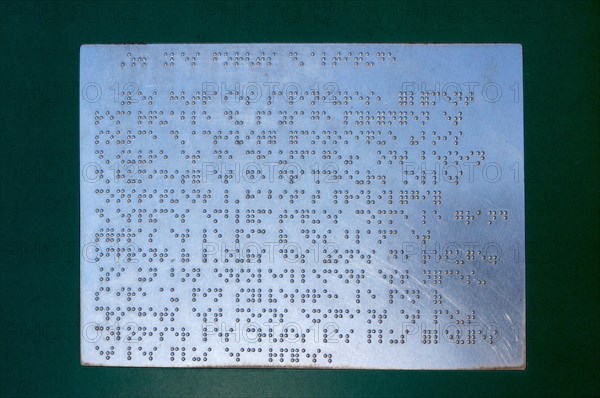Braille writing on an outside panel