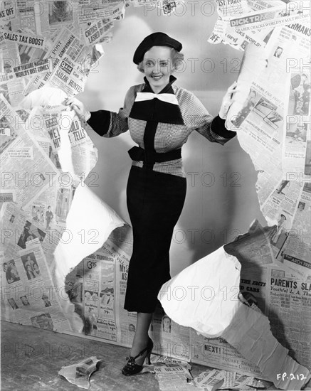 BETTE DAVIS in publicity pose for FRONT PAGE WOMAN 1935 director MICHAEL CURTIZ costume design Orry-Kelly Warner Bros.