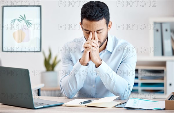 Stress, anxiety or burnout businessman working on online report or proposal deadline at office desk workplace. Mental health, headache or depressed