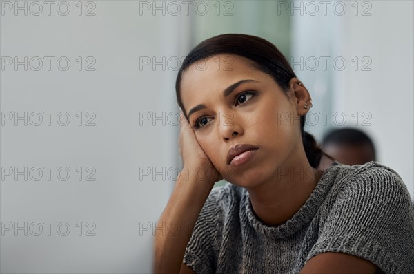 Life has been so boring lately. Shot of a young businesswoman looking bored at her desk.