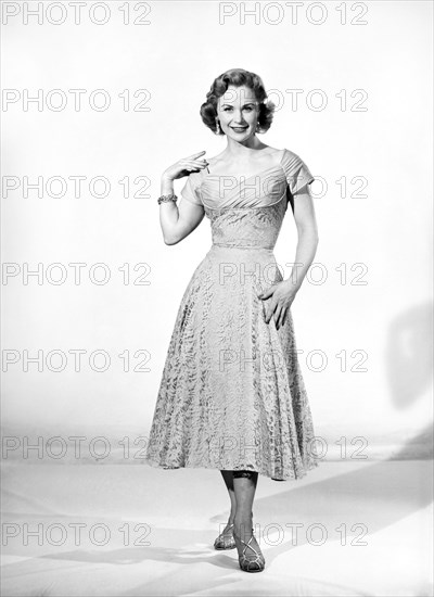 Clothing: Fashion: Dresses: Woman wearing summer dress. 1957 B304-008