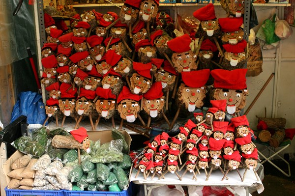 cagatios (popping logs) for sale at christmas market in placa de la catedral barcelona spain