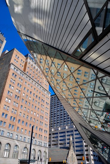 Buildings reflected in the bizarre and often criticized facade of Toronto's Royal Ontario Museum designed by Daniel Libeskind