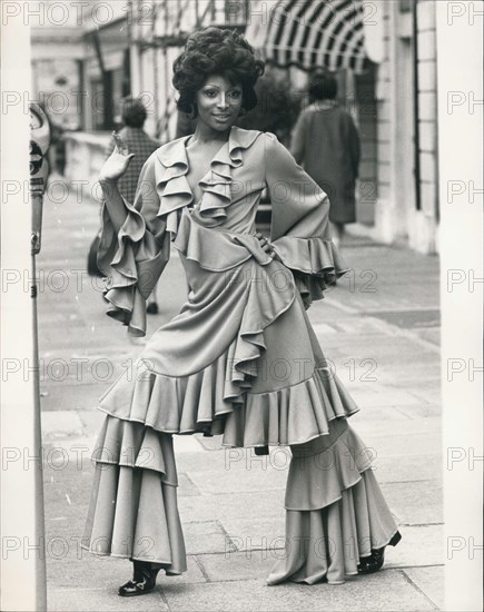 Nov. 10, 1970 - Fashion Show In London: Exquisite Knitwear Ltd., and Tricot-France S.A., both subsidiaries of Courtauld Ltd., amd large manufacturers of jersey fabrics, today stated a joint Fashion show at Celanese House, Hanove - Square, to present their Autumn 1971 ranges. Photo shows Model Enid wears a ruffled wrap-ever dress with trousers in Tricel double jersey crepe.