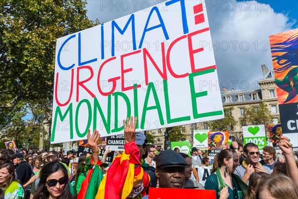 Paris, France. Crowd of Protesters holding French protest poster  at Public Ecology Demonstration, International NGO, UN Climate March Protest, global problem