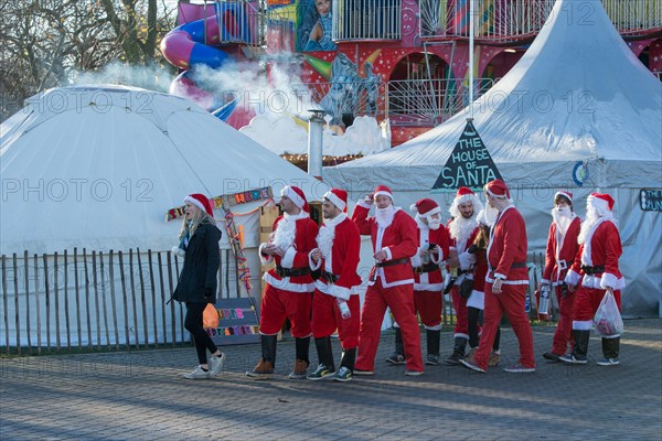 London, UK. 6th Dec, 2014. This year’s Santacon saw hundreds of people dressed up as Santa and his helpers.  They ran around London sing songs and being jolly. Credit:  Neil Cordell/Alamy Live News