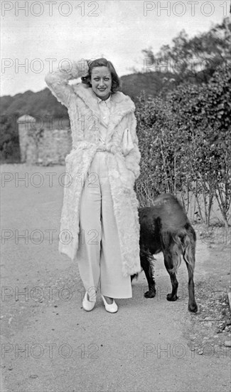 American actress Joan Crawford circa 1935 with dog