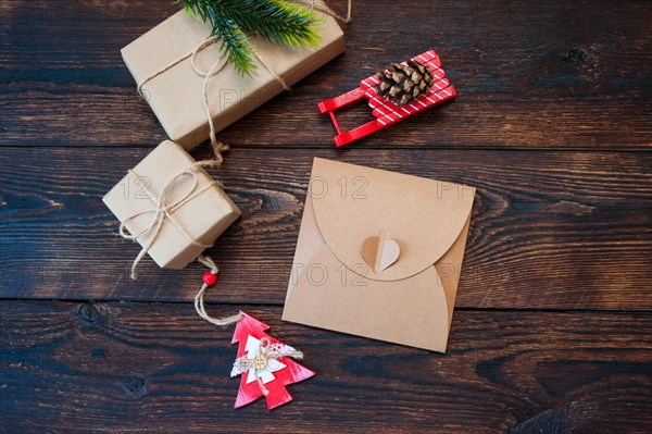 Mokcup Christmas composition of gift boxes and wooden toys on a background and place for text