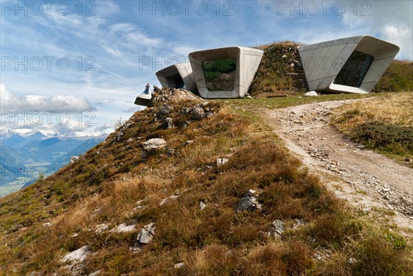 Bruneck, Italy - September 7, 2017: Backside of Messner Mountain Museum Corones (Mount Kronplatz, Dolomites) desgined by Zaha Hadid and paraglider