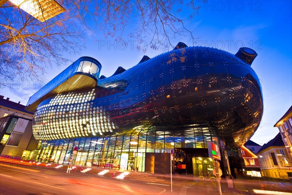 Graz, Austria - December 19, 2017 - The Kunsthaus Graz evening view, Styria region of Austria. Graz museum of Art is famous modern landmark built as p