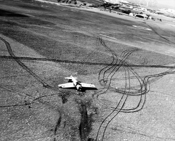 80-G-31436:  Operation Torch, November 1942.  A U.S. Navy fighter F4F on back after nosing into the soft ground at the Safi airport, Morocco, during the U.S. Campaign in North Africa.   Official U.S. Navy Photograph, now in the collections of the National Archives.  (2018/01/24). 80-G-31436_39168568244_o