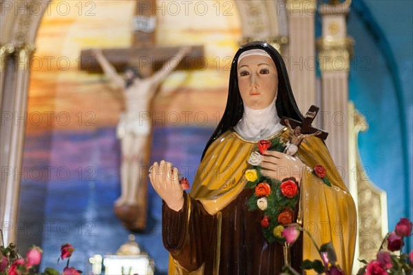 A statue of Saint Therese seen display next to the Shrine of Saint Therese of the Child Jesus in New Port City in Pasay, Metro Manila. The reliquary containing the bones of Saint Therese has been on a nation wide tour and is on its last few days in Manila before heading back to France.