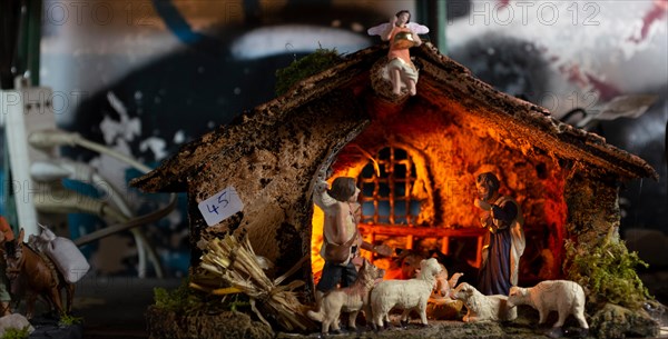 Decorating Christmas Nativity Scene, at the souvenir shop in Naples