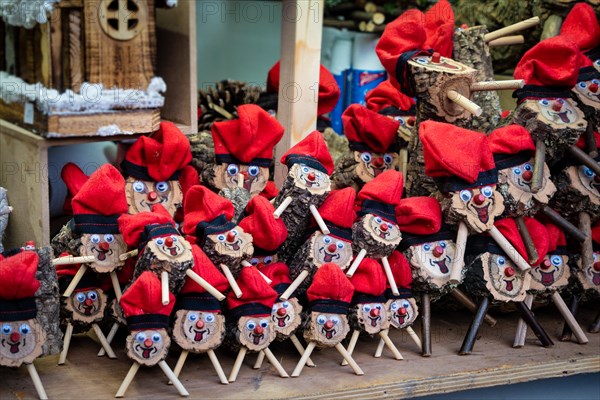 Handmade tio de nadal, a typical christmas character of catalonia, spain, on sale in a christmas market