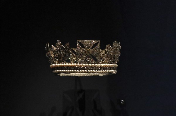 An exhibition exploring the life of George IV reunites for the first time items that were commissioned and worn by the king at his famously flamboyant coronation at Westminster Abbey , London ,in 1821 . Marking the 200 th anniversary in 2020 of the Monarch's ascent to the throne .The coronation was the most spectacular moment of george's life and came at a cost of more than -ú240.000 . the King himself oversaw the design of his coronation robes , including the crimson velvet surcoat and a stole made from cloth of silver , gold thread and silk embroided with the national flowers of the UK .