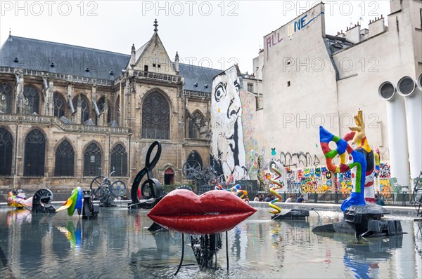 PARIS - SEPT 17, 2014: The Stravinsky Fountain is a whimsical public fountain ornamented with 16 works of sculpture, moving and spraying water, repres