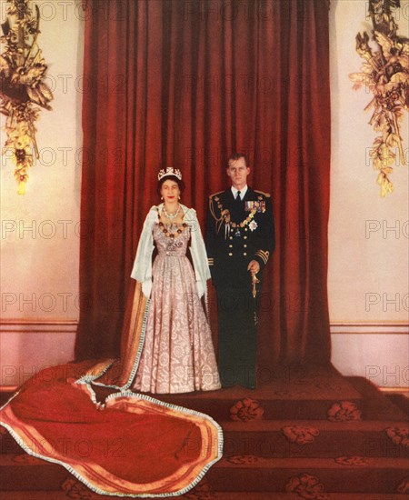 EDITORIAL ONLY Queen Elizabeth II and the Duke of Edinburgh, seen here after the State Opening of Parliament, 1952.  Elizabeth II, Queen of the United Kingdom, 1926 - 2022.  Prince Philip, Duke of Edinburgh, born Prince Philip of Greece and Denmark,1921- 2021. Husband of Queen Elizabeth II of the United Kingdom. From The Queen Elizabeth Coronation Book, published 1953.