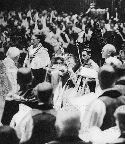 His Majesty King George VI (1895-1952) receives the Sceptre with the Cross and the Sceptre with the Dove, at his coronation, 1937. George VI's coronation took place on 12th May 1937 at Westminster Abbey, the date previously intended for his brother Edward VIII's coronation.
