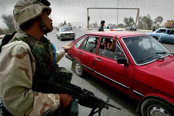 Iraq War April 2003 Baghdad American marines take postions in Eastern Baghdad whilst liberating the city as local iraqi s start