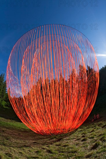 The Pier Fabre's Land Art work called "the Wakening".
Giant suspended mobile sculpture with orange ribbons.