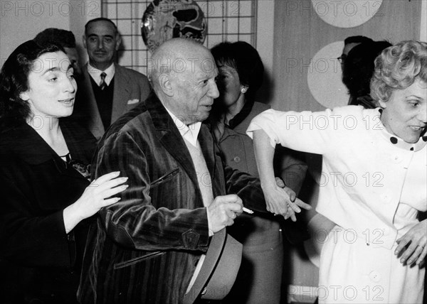 Artist Pablo Picasso with Mademoiselle Ramier and his wife Jacqueline Roque at his gallery exhibition
