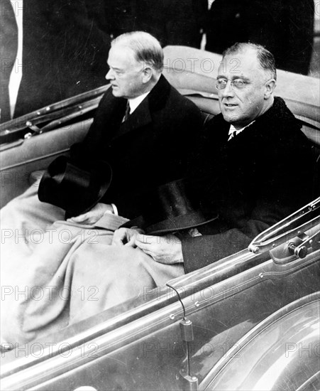 Franklin Delano Roosevelt and Herbert Hoover in convertible automobile on way to U.S. Capitol for Roosevelt's inauguration, March 4, 1933