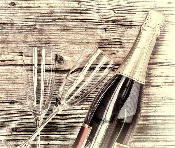 Champagne. Champagne bottle and two empty glasses on a wooden background. Valentine's Day. Birthday. Wedding. Anniversary. Rustic style.