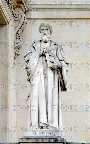 Paris, France. Palais du Louvre. Statue in the Cour Napoleon: Michel de l'Hôpital (or l'Hospital) (1507 – 1573) French statesman.