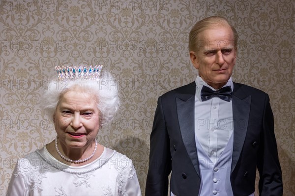 Wax statues of Queen Elizabeth II and Prince Philip at the Krakow Wax Museum - Cracow, Poland.