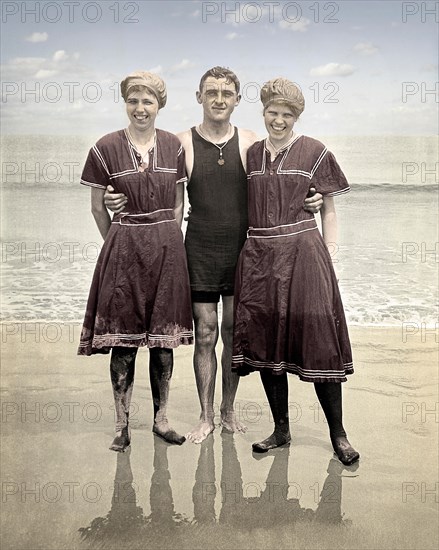 Three beach goers posing in the latest fashion, circa 1915. Image from 4.5 x 2.75 inch nitrate negative.