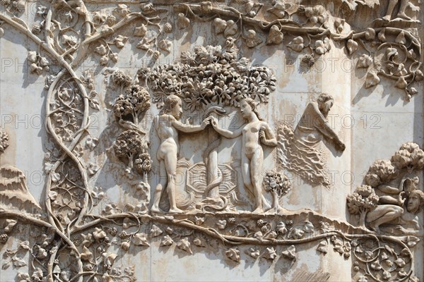 Adam & Eve in the garden of Eden, external bas-relief of Orvieto cathedral, Italy