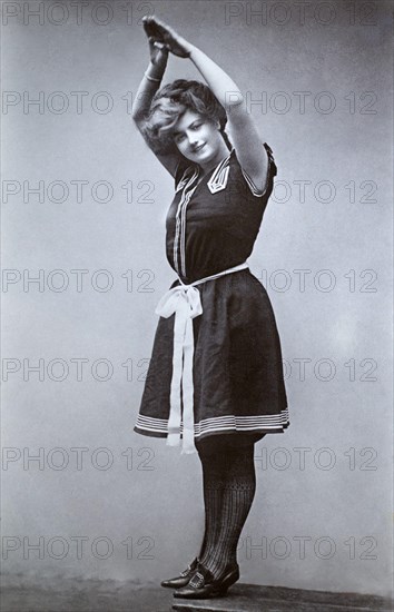 The notable Edwardian English stage, and later silent film, actress Ethel Oliver (active c. 1903-1933) wearing a swimming costume of the period, taken from a photographic postcard from the era.