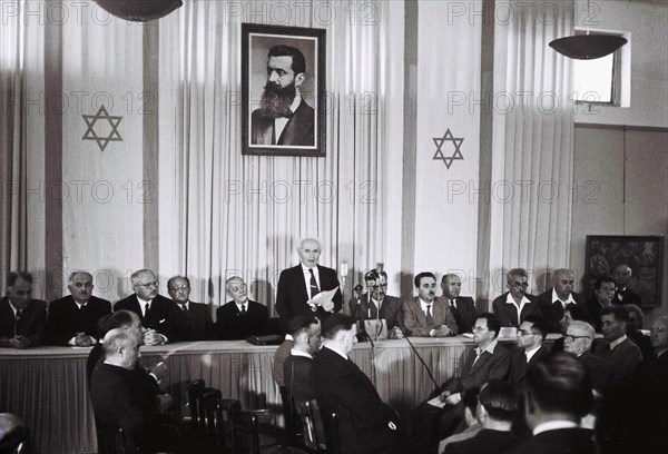 David Ben Gurion, who was to become Israel's first Prime Minister, reads the Israeli Declaration of Independence May 14, 1948 at the museum in Tel Aviv, during the ceremony founding the State of Israel.