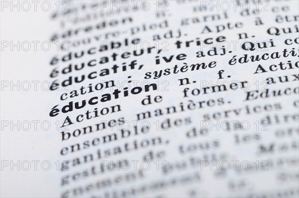 Close up of french dictionary at the word Education