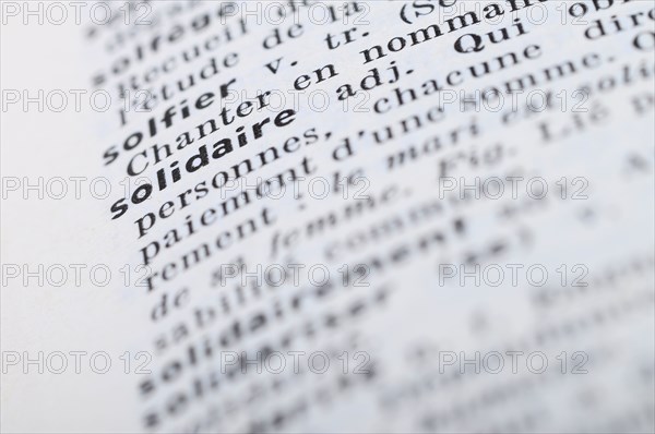 Close up of french dictionary at the word Solidary