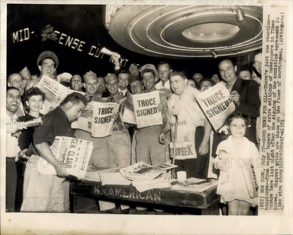 Jul. 27, 1953 - News For All: There's just one reaction: happiness from eager buyers of extra editions of newspapers in Times square her last night after the signing of the armistice agreement in Korea. Biggest grins are those on the faces of servicemen.