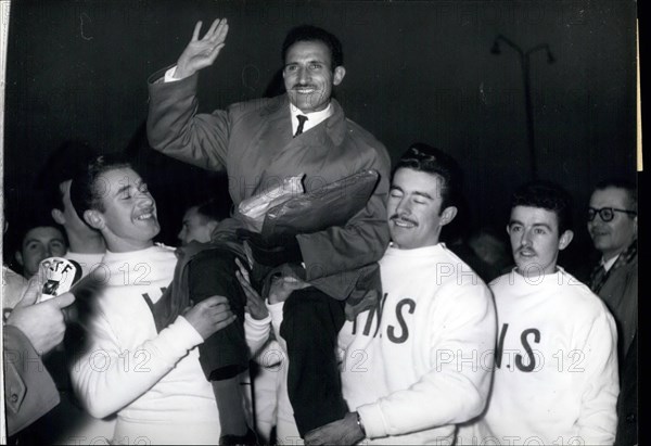 Dec. 12, 1956 - Back From Lebourne. Photo shows Alain Mimoun Winner Of The Olympic Marathon, Being Chaired By Fellow Athletes As He Arrived At Orly Airfield This Morning.